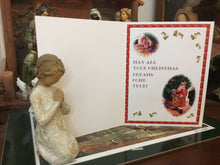 Load image into Gallery viewer, Inside of the Santa Clause Christmas card designed & Illustrated by Suzanne Davis Harden: "May All Your Christmas Dreams come True!" is the text on the card. It features two vignettes from the front cover of the card's illustration and several little dancing holly leaves arranged in a border around the page. A bright red border surrounds the page.